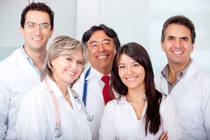 Picture of a group of Physicians. There is two Females and three Males.