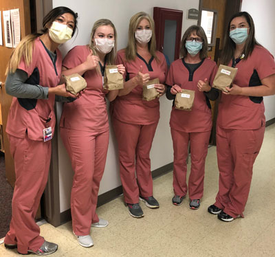 WCHC's laboratory staff. There are five female Nurses wearing mask.